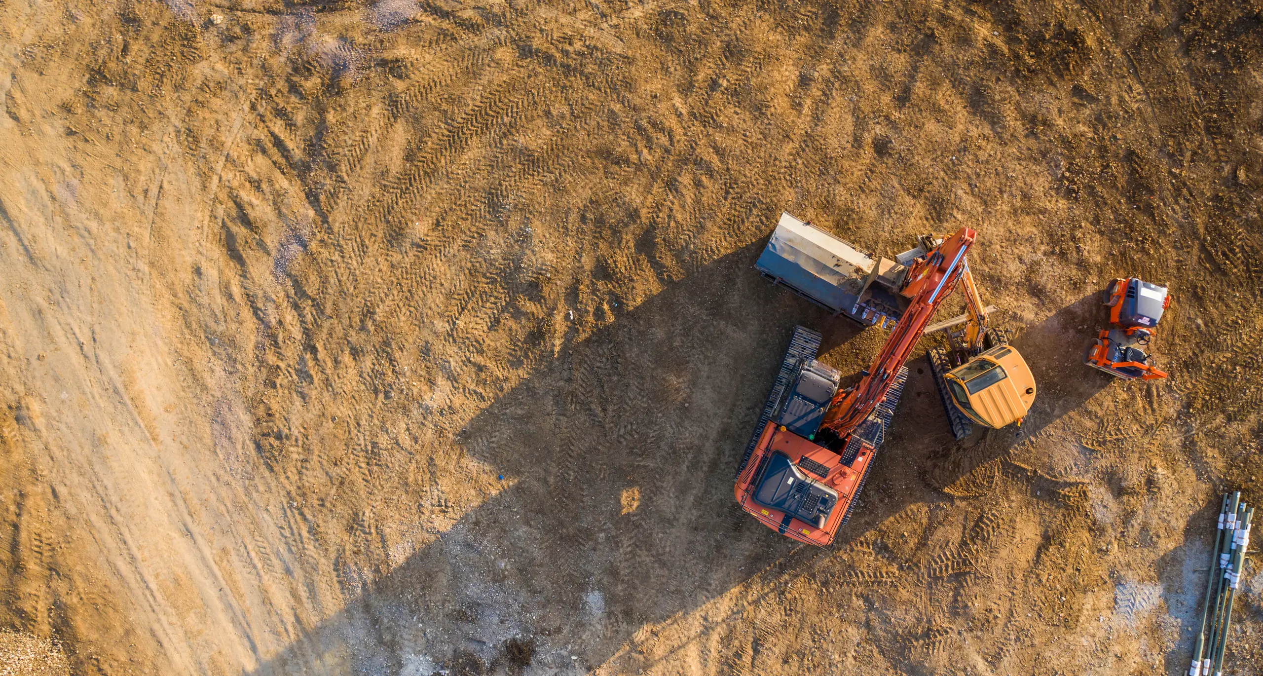 Aerial view of an orange digger at work
