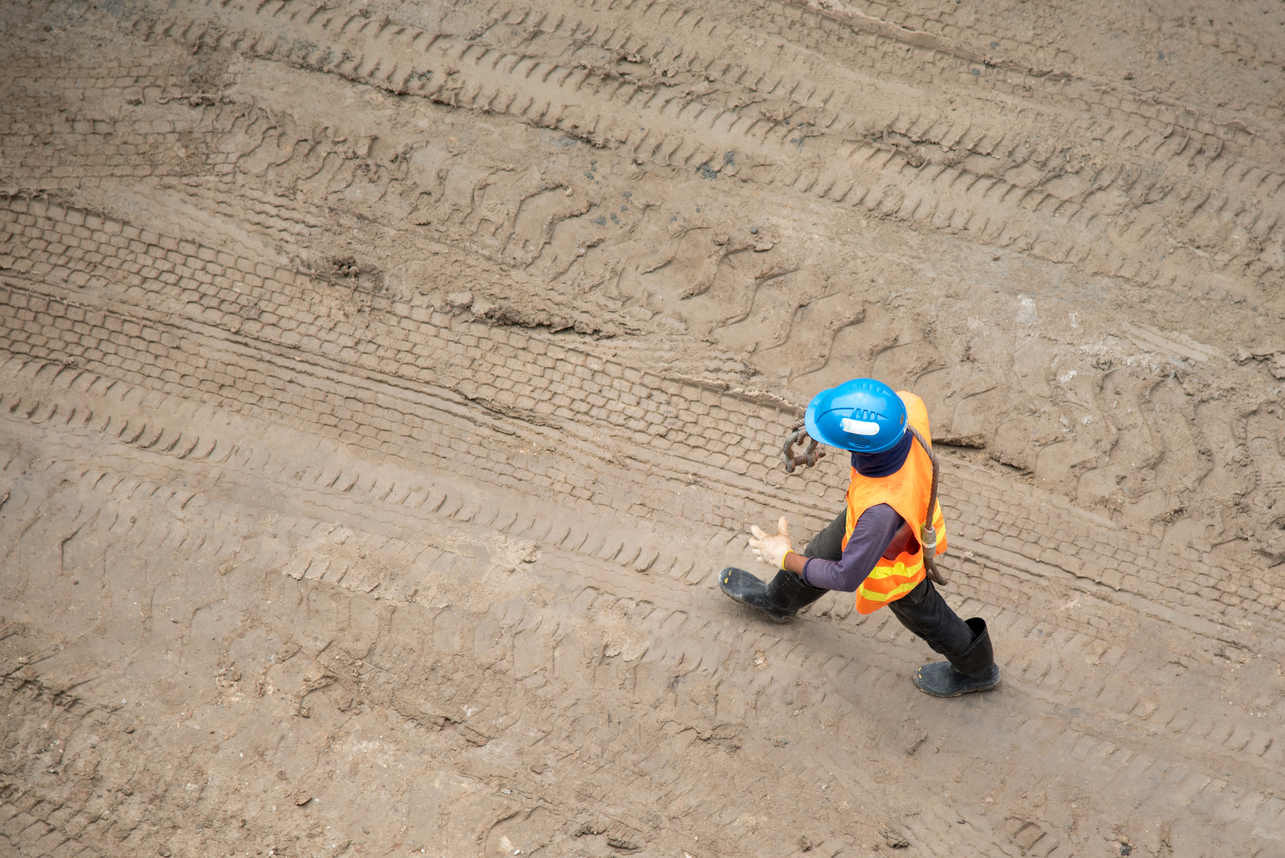 A construction worker walking